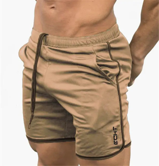 man wearing tan drawstring shorts with pockets