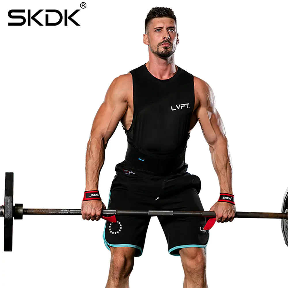 athletic man lifting weights using power lifting wrist straps 