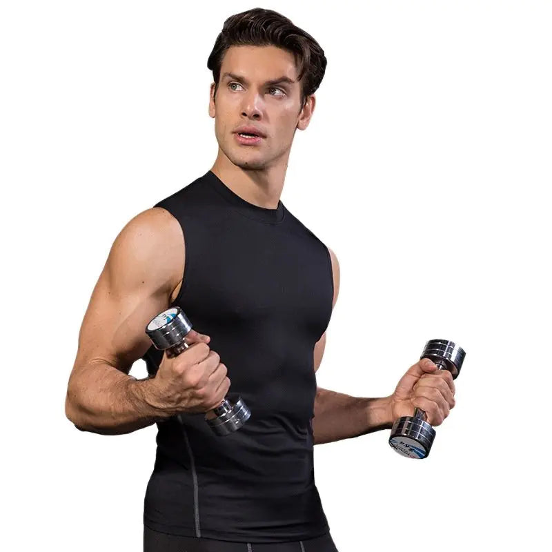 Man working out wearing a black compression tank top 